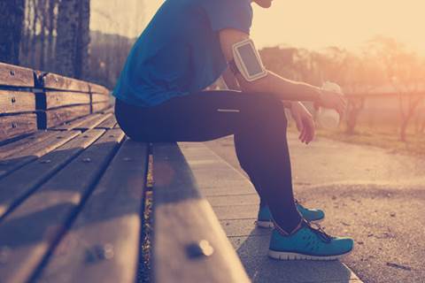 Runner sitting on a bench.