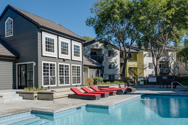 Outdoor swimming pool area with sundeck.