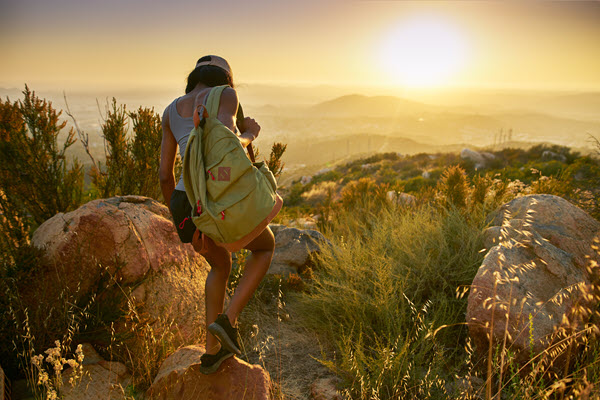 Girl hiking at sunrise