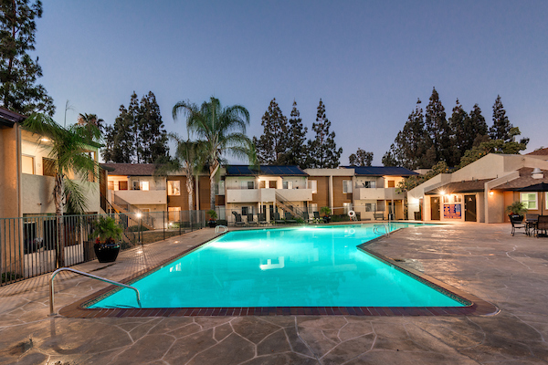 Outdoor swimming pool area at dusk.
